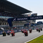 The grid formed in front of the biggest crowd MotoGP has ever seen and it was Marc Marquez who shot into the lead as Bagnaia dropped down the order to P5.