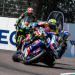 Toprak Razgatlioglu denied Axel Bassani an emotional maiden victory but gained 25 points on Alvaro Bautista as the reigning Champion crashed out.