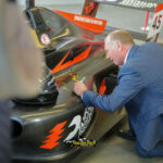 All four signed the Innovation F4 car.